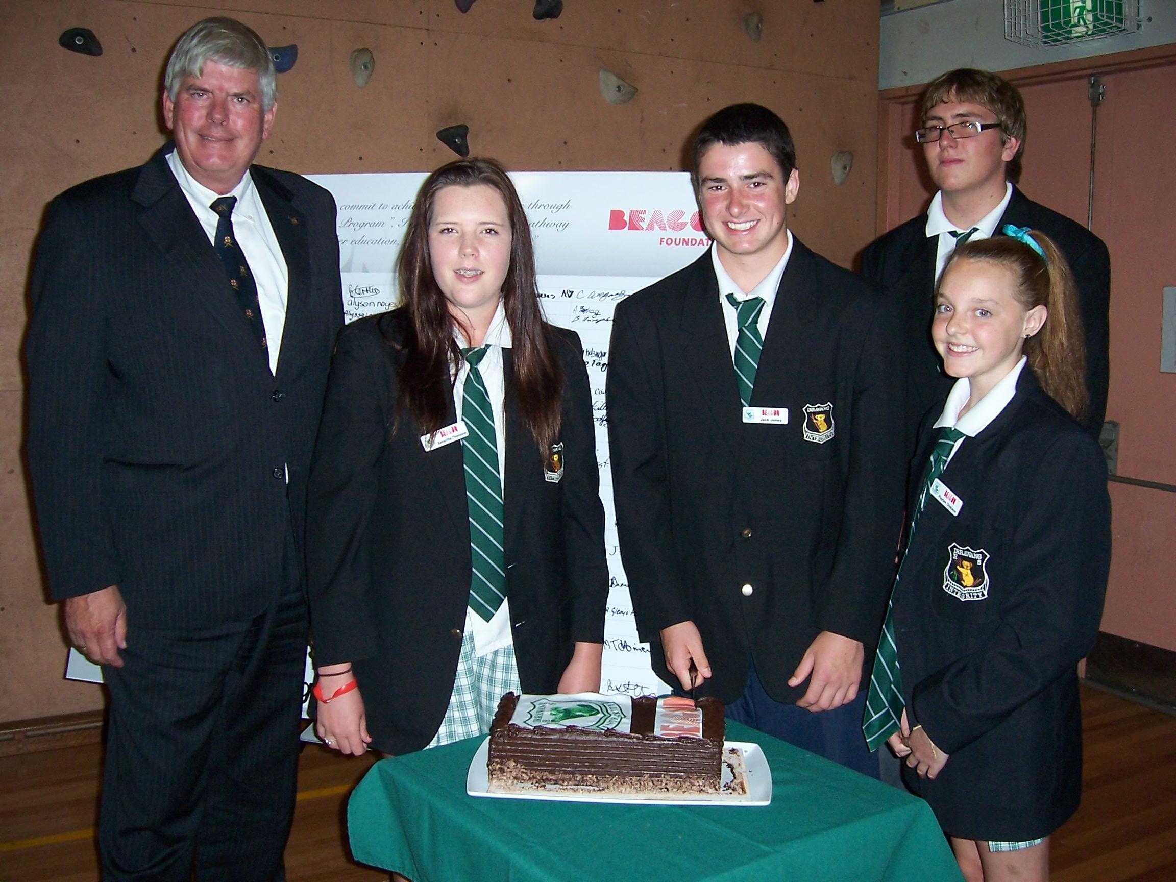 Mr Baumann MP presenting the state flag